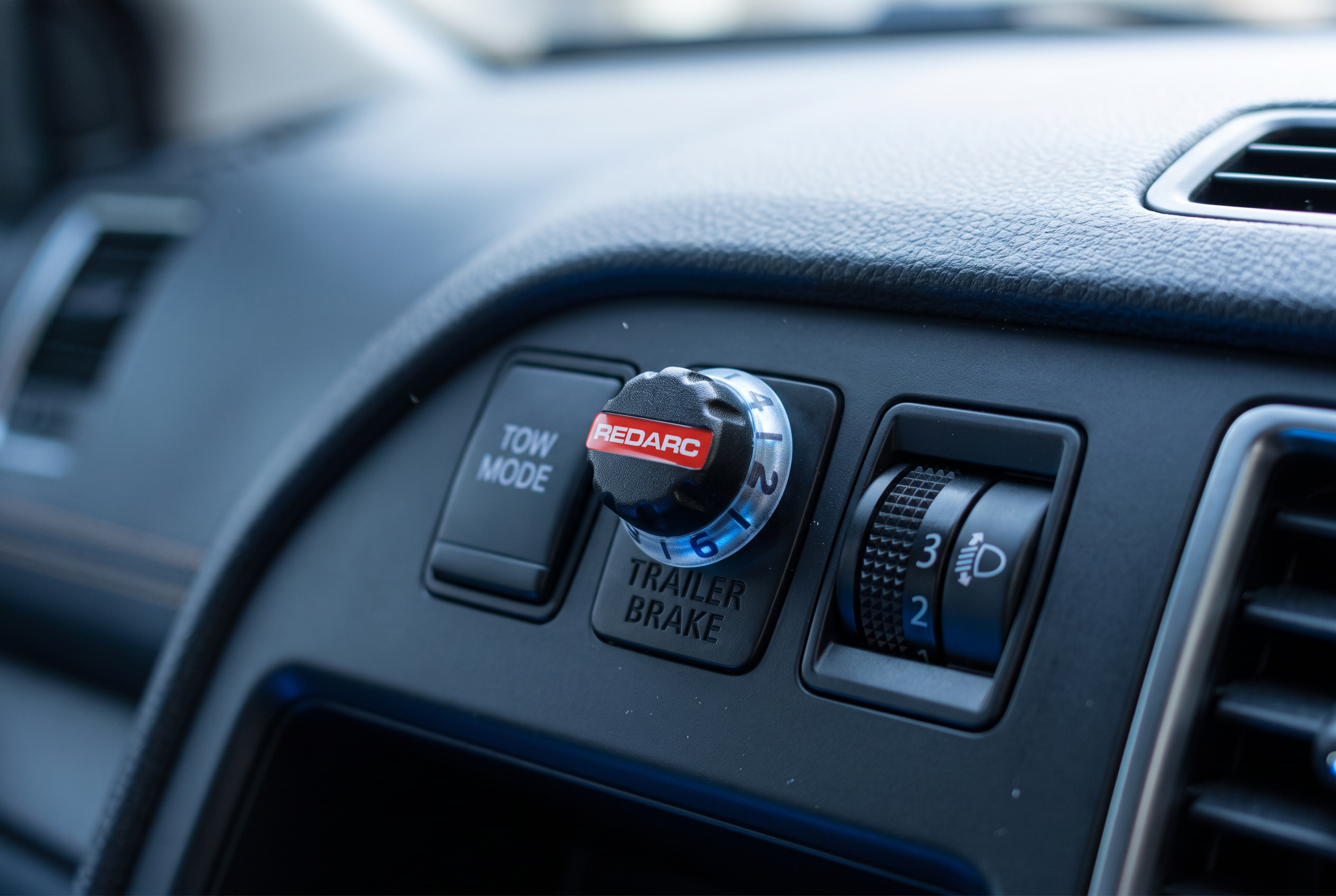 REDARC trailer brake controller installed on a 4WD dashboard